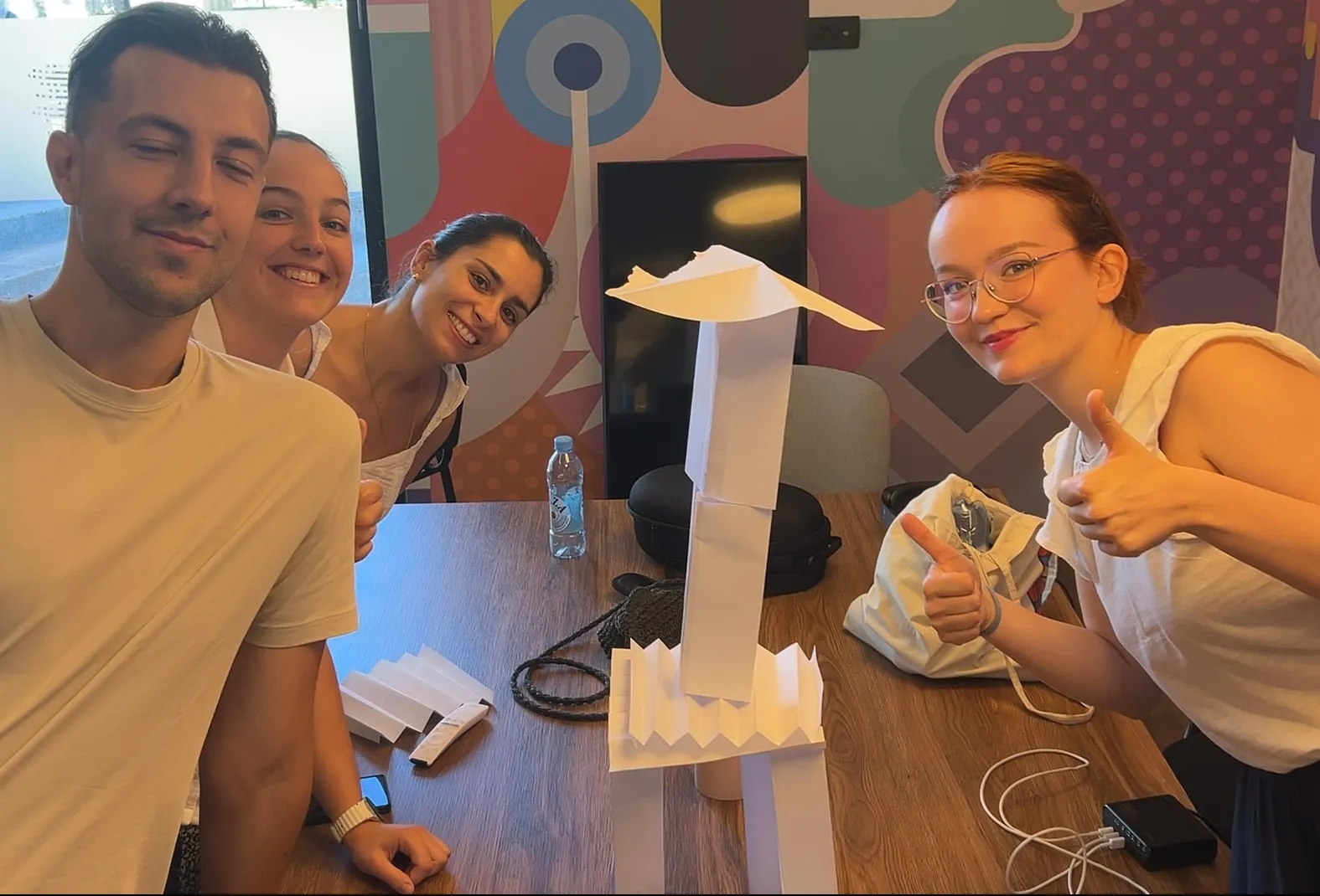 Build the tallest stable free-standing structure possible using: 10 sheets of paper and 1 meter of tape