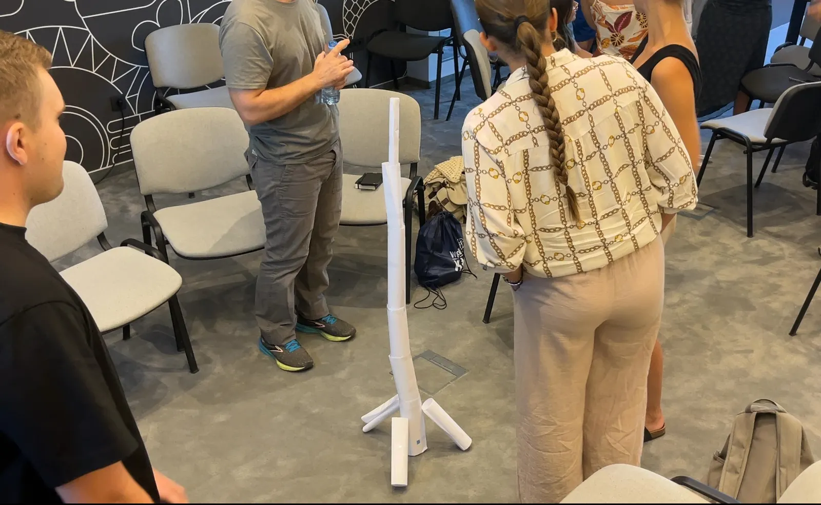 Build the tallest stable free-standing structure possible using: 10 sheets of paper and 1 meter of tape